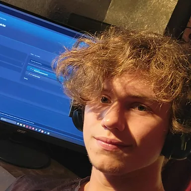 Jacob Cook at his desk, with Hawser open on the monitor behind him